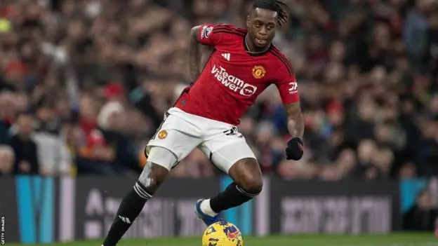 Manchester United exercises one-year contract option for Aaron Wan-Bissaka